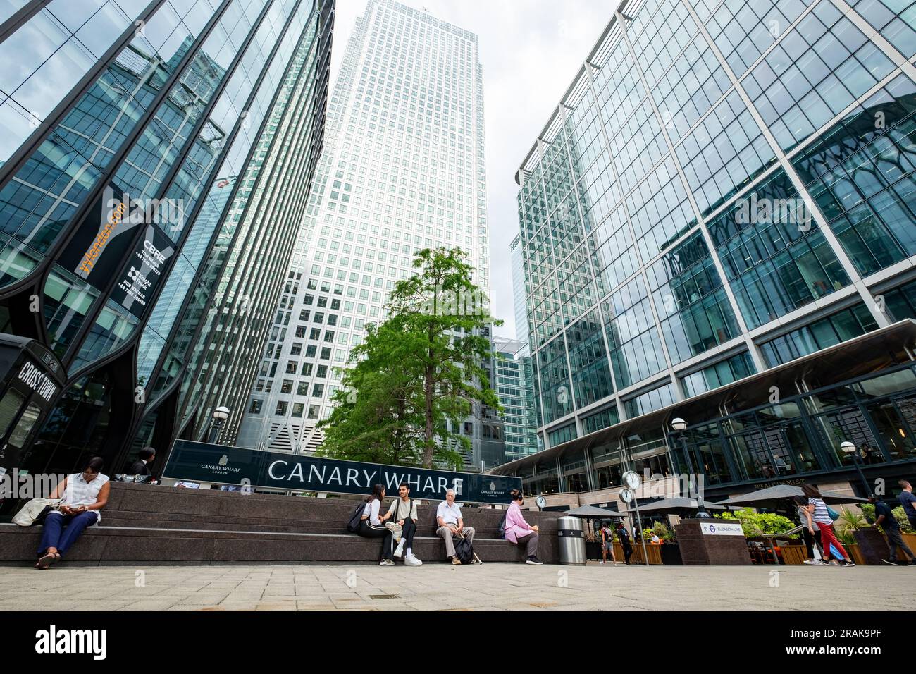 London- June 2023: Canary Wharf buildings and office workers on Reuters Plaza- Major London financial centre Stock Photo