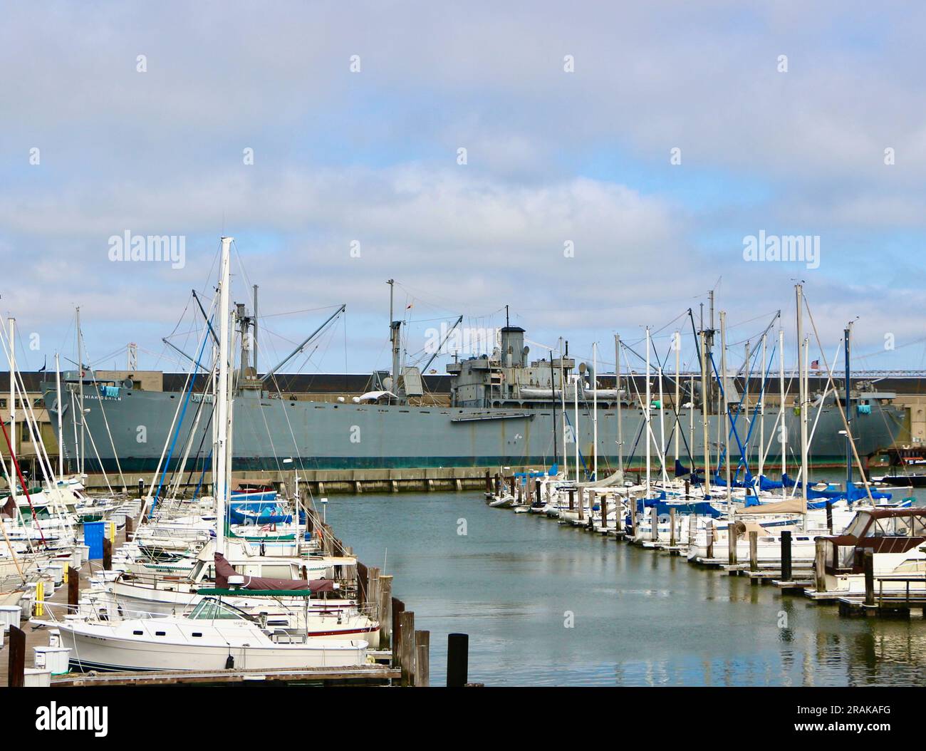 View of SS Jeremiah O'Brien historic WW2 ship moored at Pier 35 seen from Pier 39 marina San Francisco California USA Stock Photo