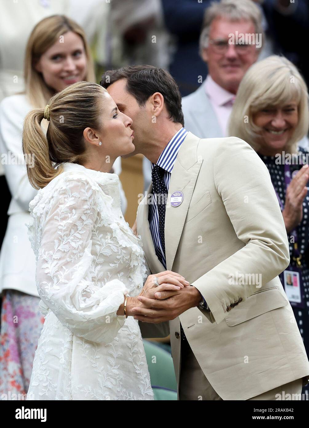 London, Britain. 4th July, 2023. Roger Federer (front R) kisses his wife Mirka Federer (front L) at Centre Court ahead of play on Day 2 of Wimbledon Tennis Championships in London, Britain, July 4, 2023. Credit: Han Yan/Xinhua/Alamy Live News Stock Photo