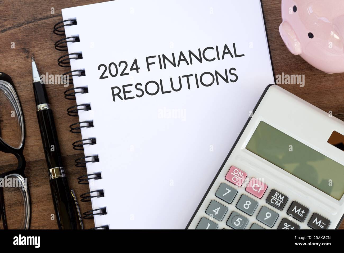Notepad with text 2024 financial resolutions Stock Photo Alamy