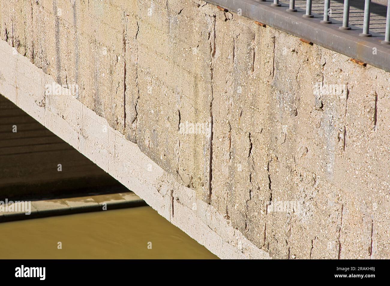 Old reinforced concrete structure with damaged and rusty metallic