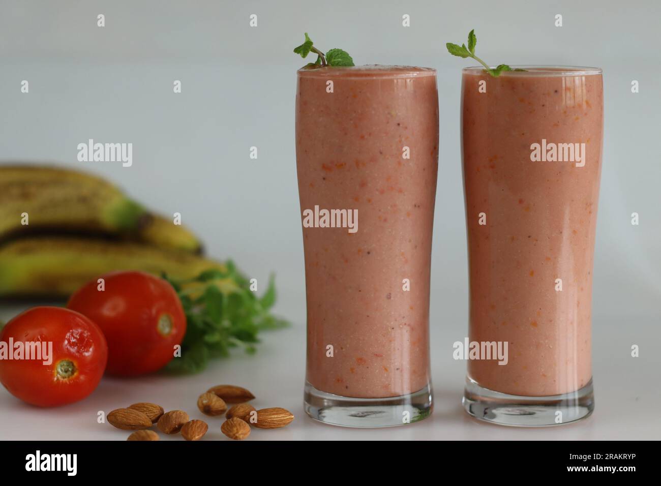Tomato banana smoothie. A healthy drink made of ripe tomatoes and