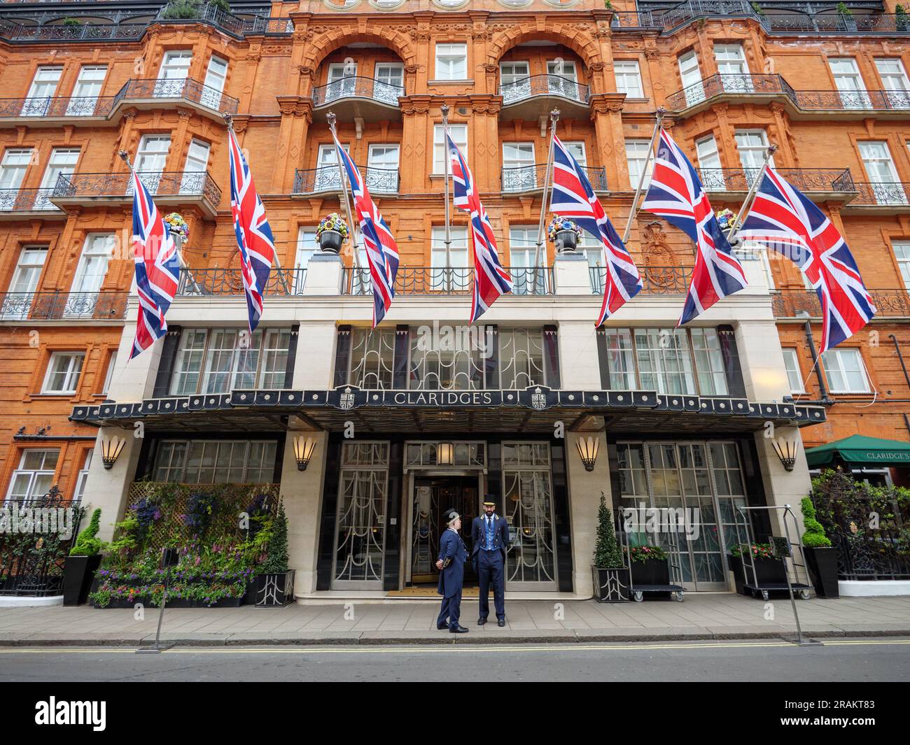 Doormen standing outside Claridge’s Hotel, London, UK Stock Photo