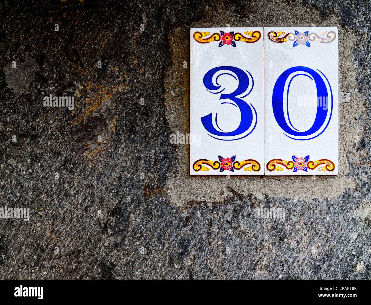 Thirty, number 30, ornamental tile on a wall Stock Photo - Alamy