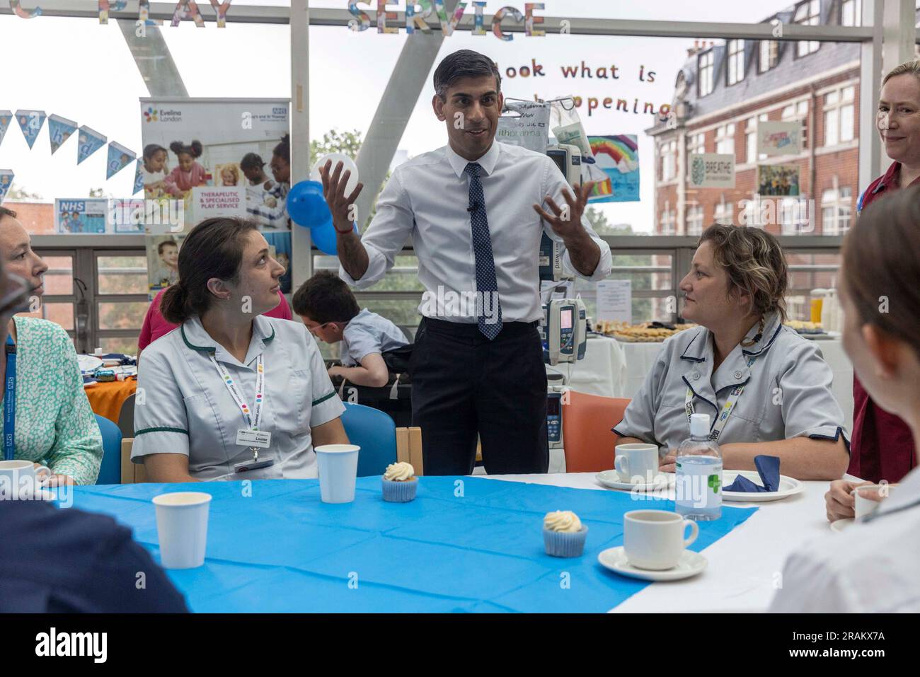 Prime Minister Rishi Sunak visits the Evelina Children's ward at St Thomas' hospital to take part in a NHS Big Tea celebration to mark the 75th anniversary of the NHS, in central London, Tuesday July 4, 2023.. (Jack Hill/Pool Photo via AP) Stock Photo
