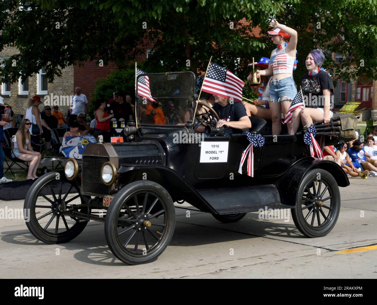 Racine, Wisconsin, USA. 4th July, 2023. A 1916 Model T Ford passes by The Legacy Museum and Veterans Center during the Fourth of July parade in Racine, Wisconsin, Tuesday July 4, 2023. (Credit Image: © Mark Hertzberg/ZUMA Press Wire) EDITORIAL USAGE ONLY! Not for Commercial USAGE! Stock Photo