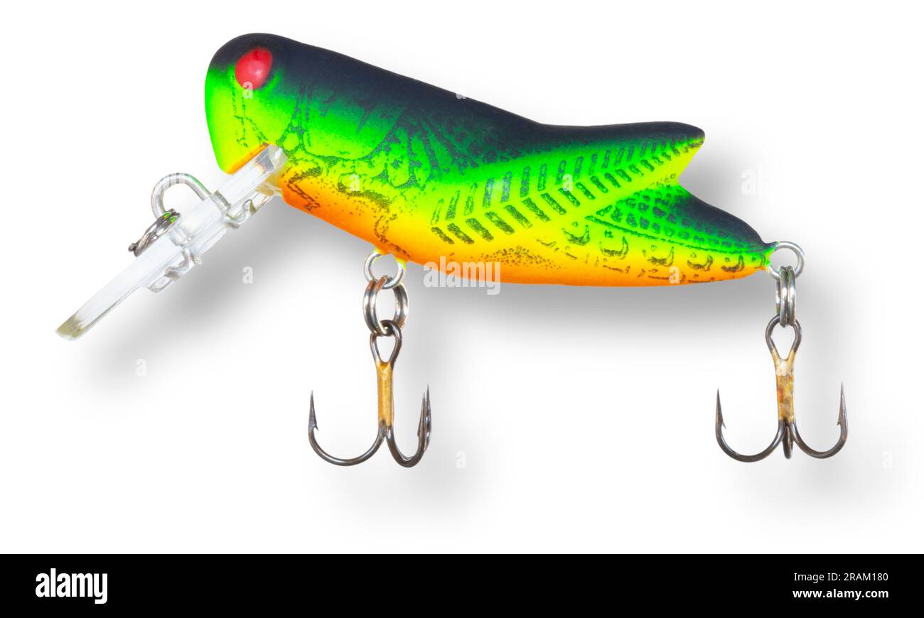 Grasshopper fishing lure with green and orange color and a shadow
