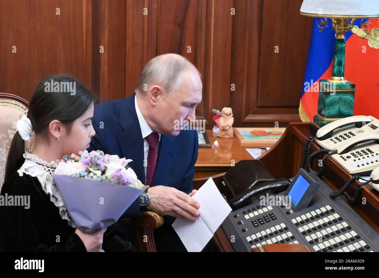 Russian President Vladimir Putin shows 8 year old Raisat Akipova, from ...