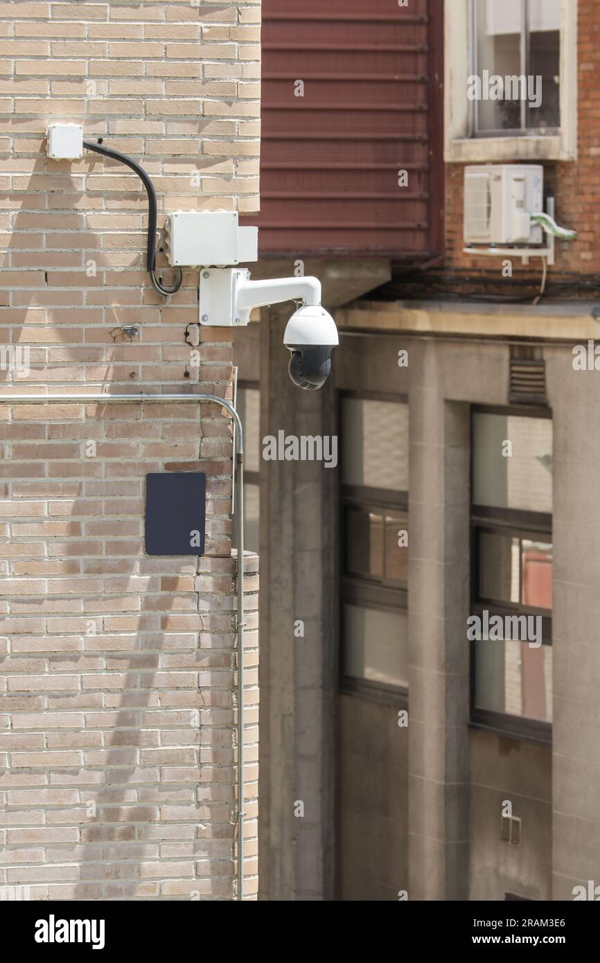 Security and surveillance cameras installed on a street corner Stock