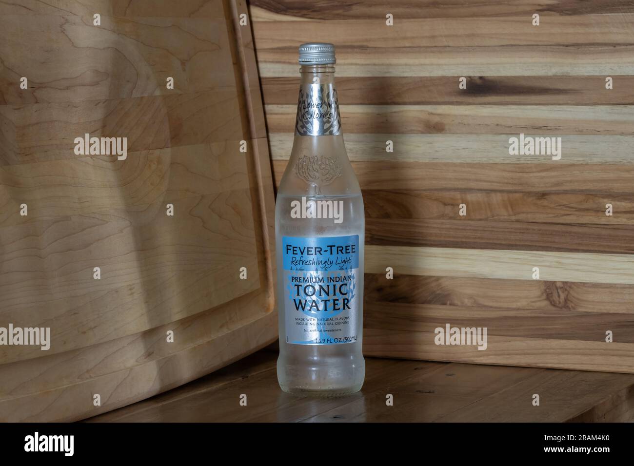 bottle of Fever Tree brand premium Indian tonic water with quinine on a rustic background Stock Photo