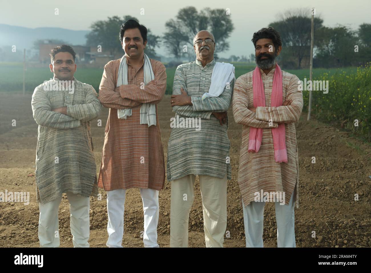 Beautiful portrait composition of Indian farmers standing in field ...