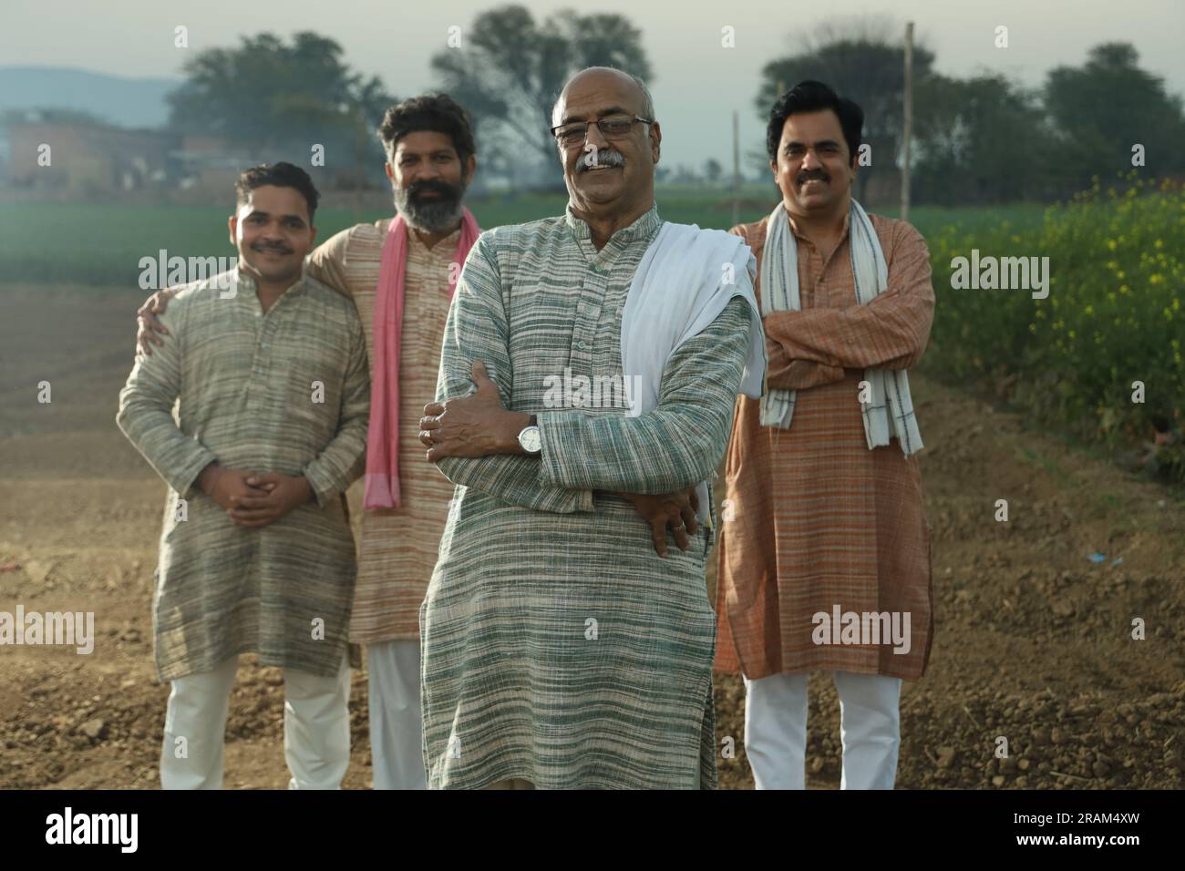 Beautiful portrait composition of Indian farmers standing in field ...