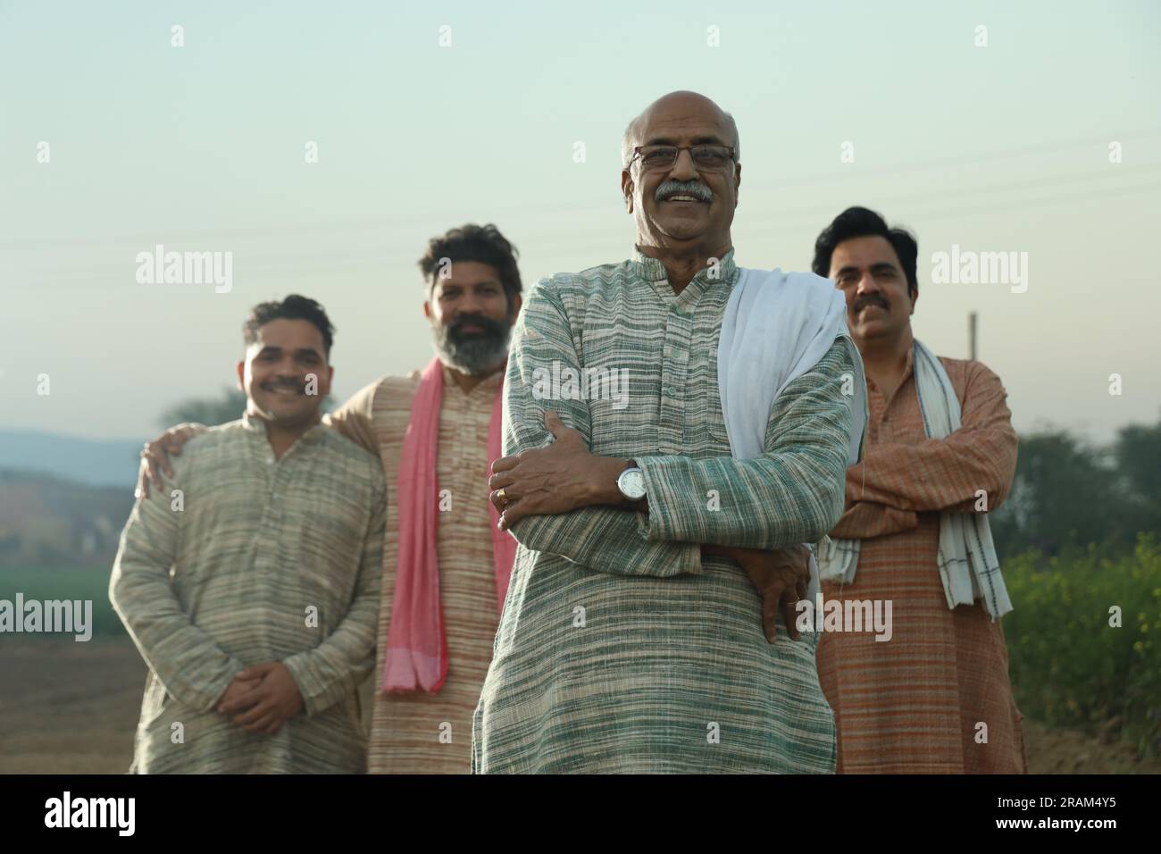 Beautiful portrait composition of Indian farmers standing in field ...