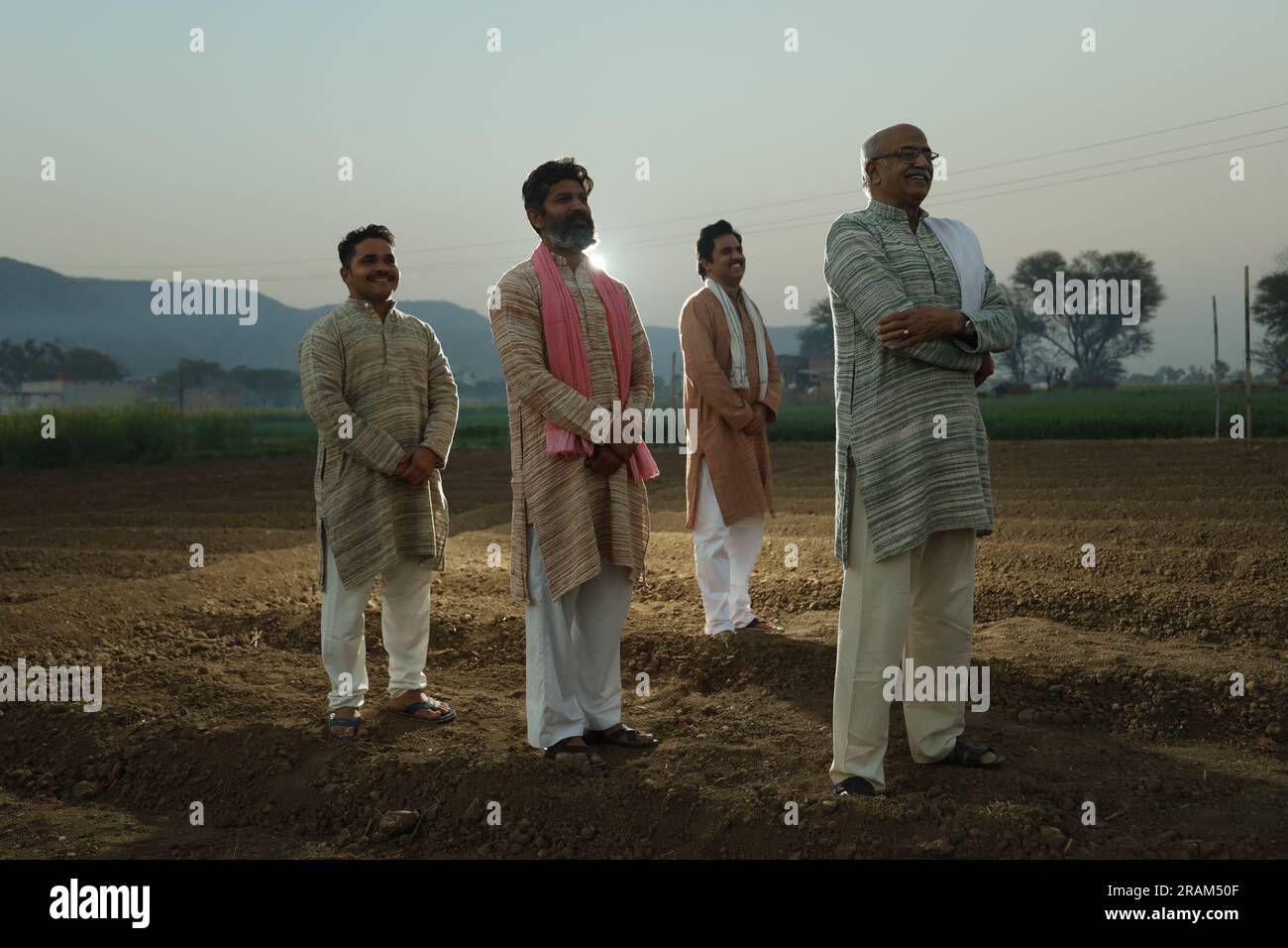 Beautiful portrait composition of Indian farmers standing in field ...