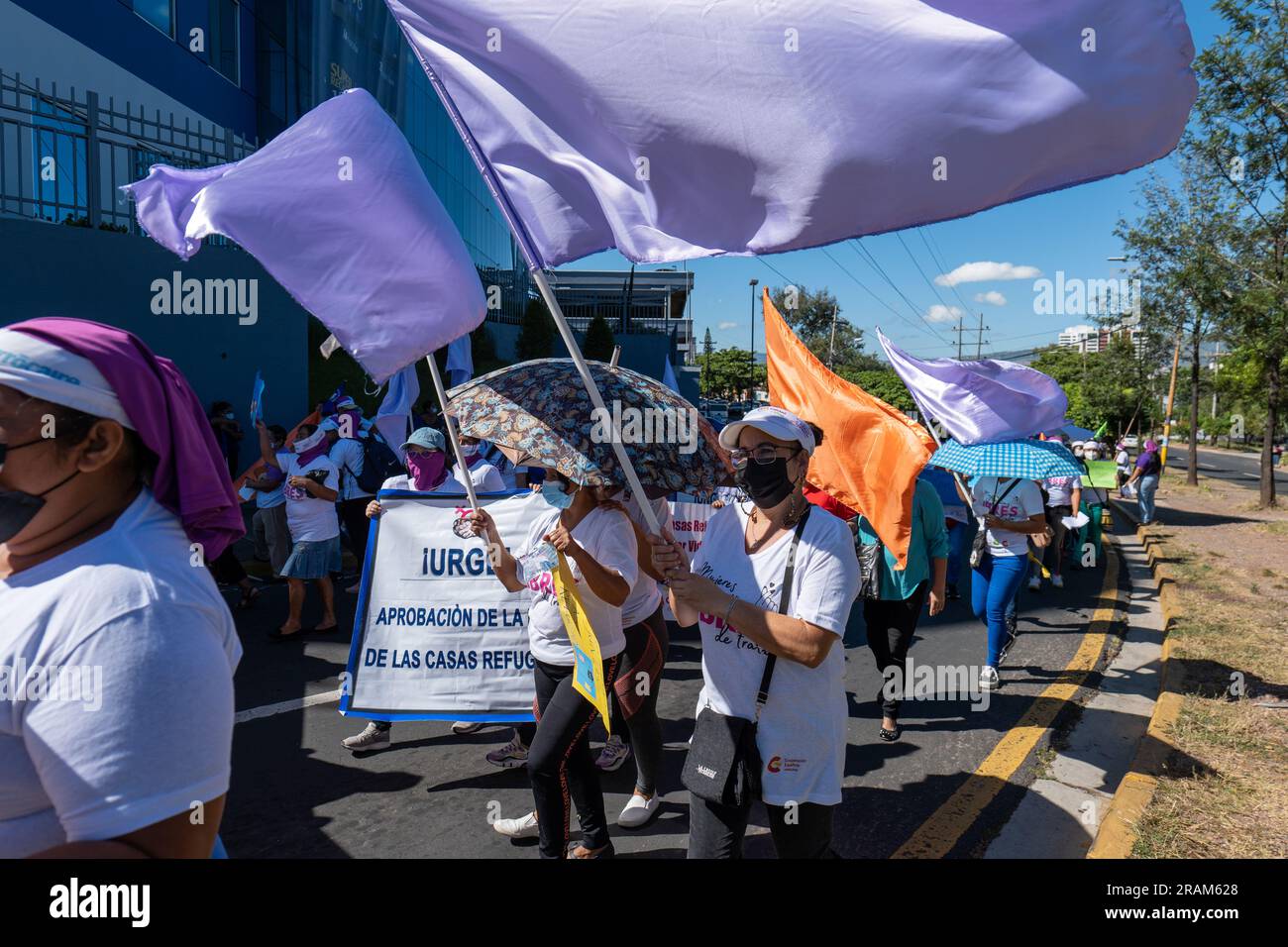 Tegucigalpa, Francisco Morazan, Honduras - November 25, 2022: Several Women with Flags March for the International Day for the Elimination of Violence Stock Photo