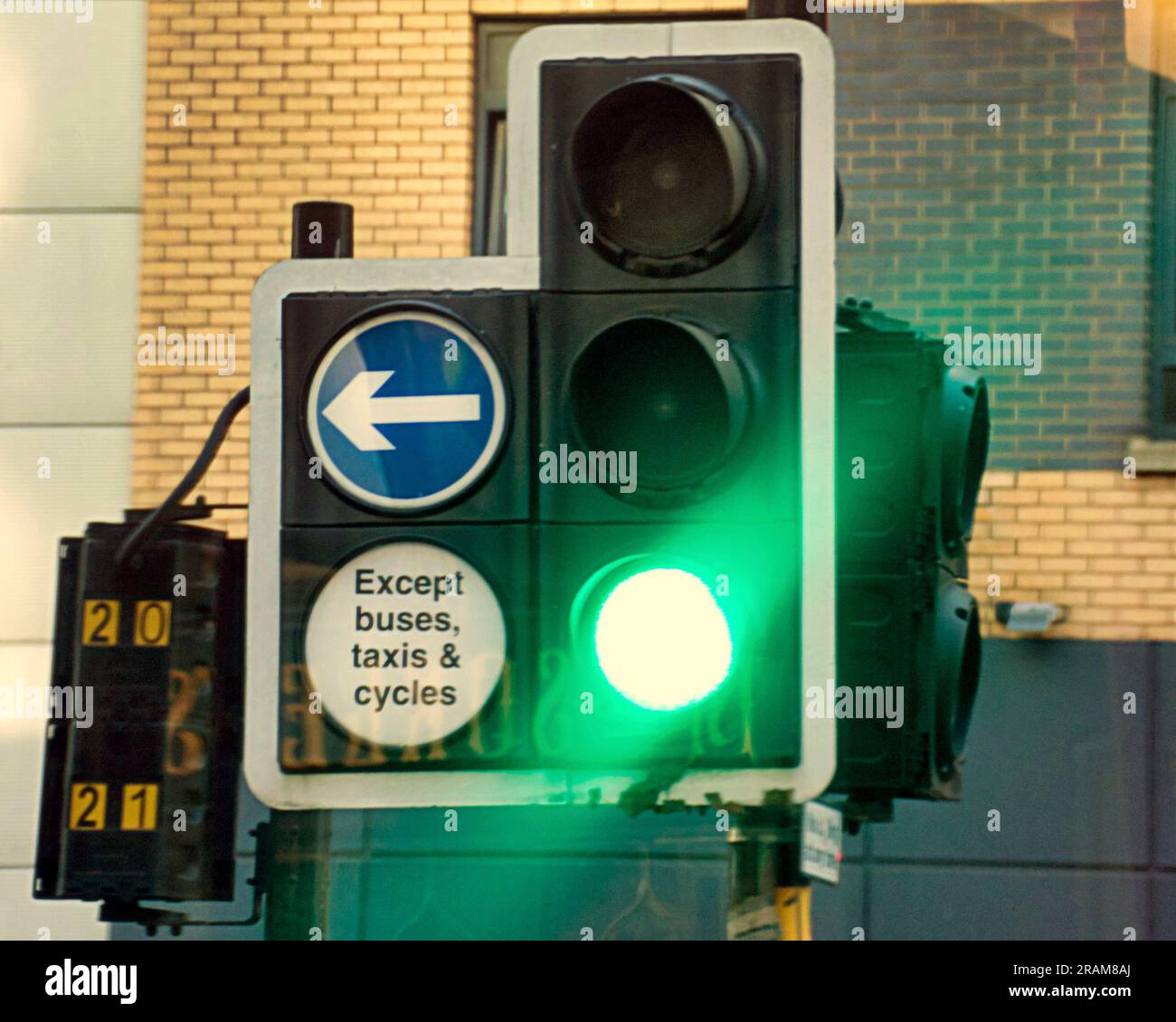 green traffic lights except buses, taxis and cycles Stock Photo