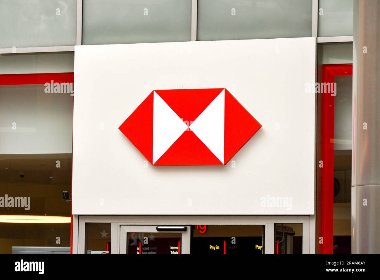 London, England, UK - 28 June 2023: Sign above the entrance of a branch of HSBC bank in central London. Stock Photo