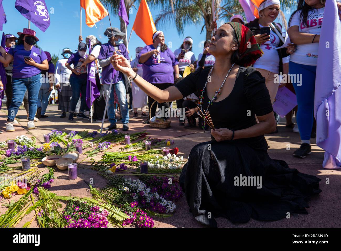 Tegucigalpa, Francisco Morazan, Honduras - December 11, 2022: Woman with Colorful Scarf Lights Incense and Prepares an Offering for the International Stock Photo