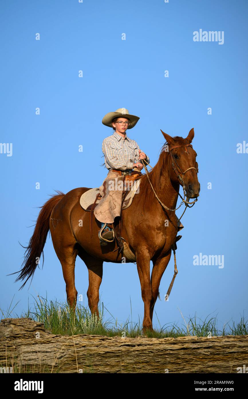 Ada on horseback; Dennis Ranch, Red Owl, South Dakota. Stock Photo