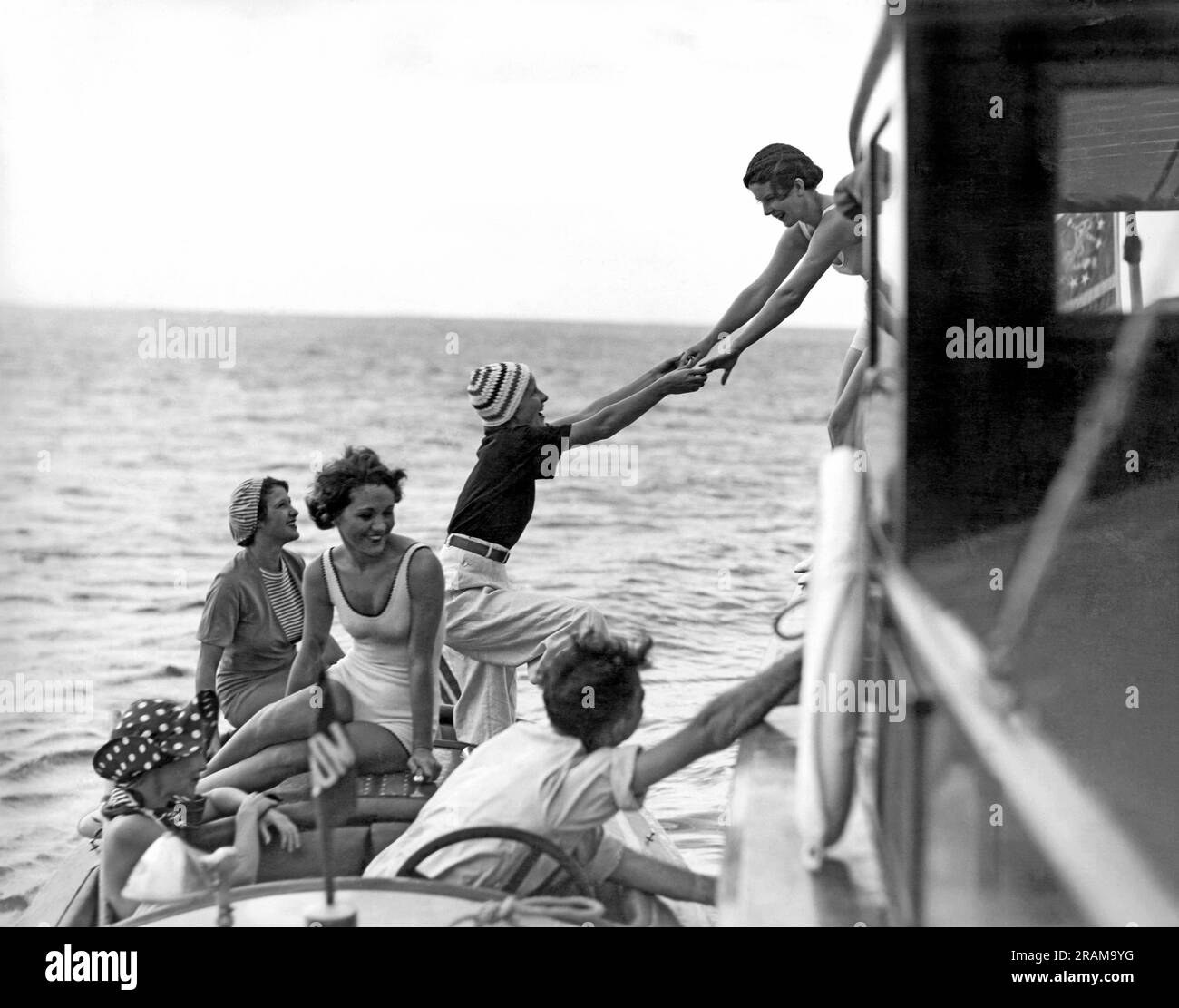 Miami, Florida:  c. 1924. Society women board a fishing cruiser at the Key Largo Anglers Club Stock Photo