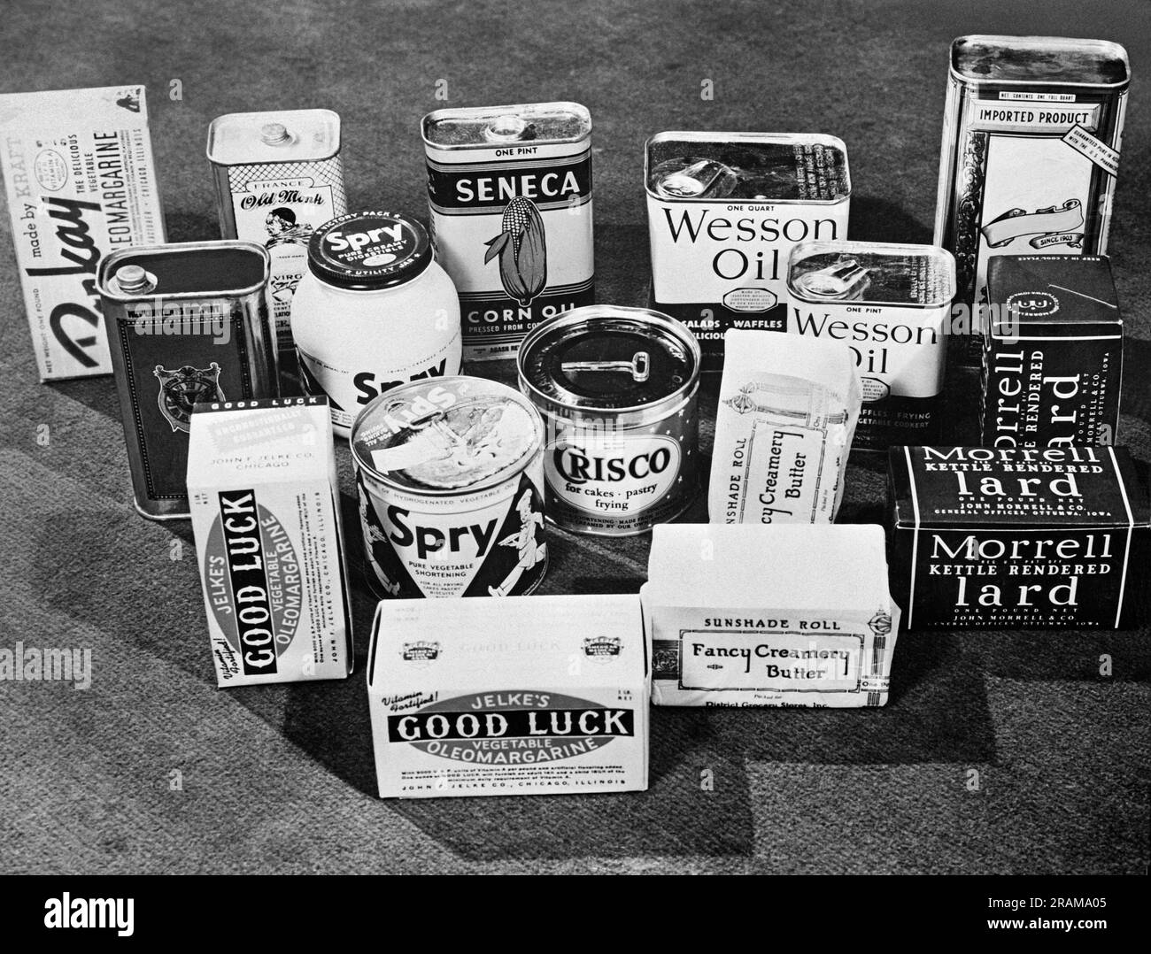 United States:  1943 Various cooking and baking products available to the consumer including, butter, oleomargarine, lard, shortenings and vegetable and olive oils. Stock Photo