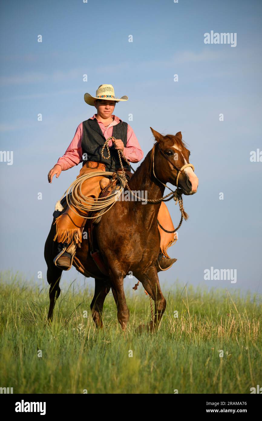 Gus Dennis riding his horse at Dennis Ranch in Red Owl, South Dakota. Stock Photo