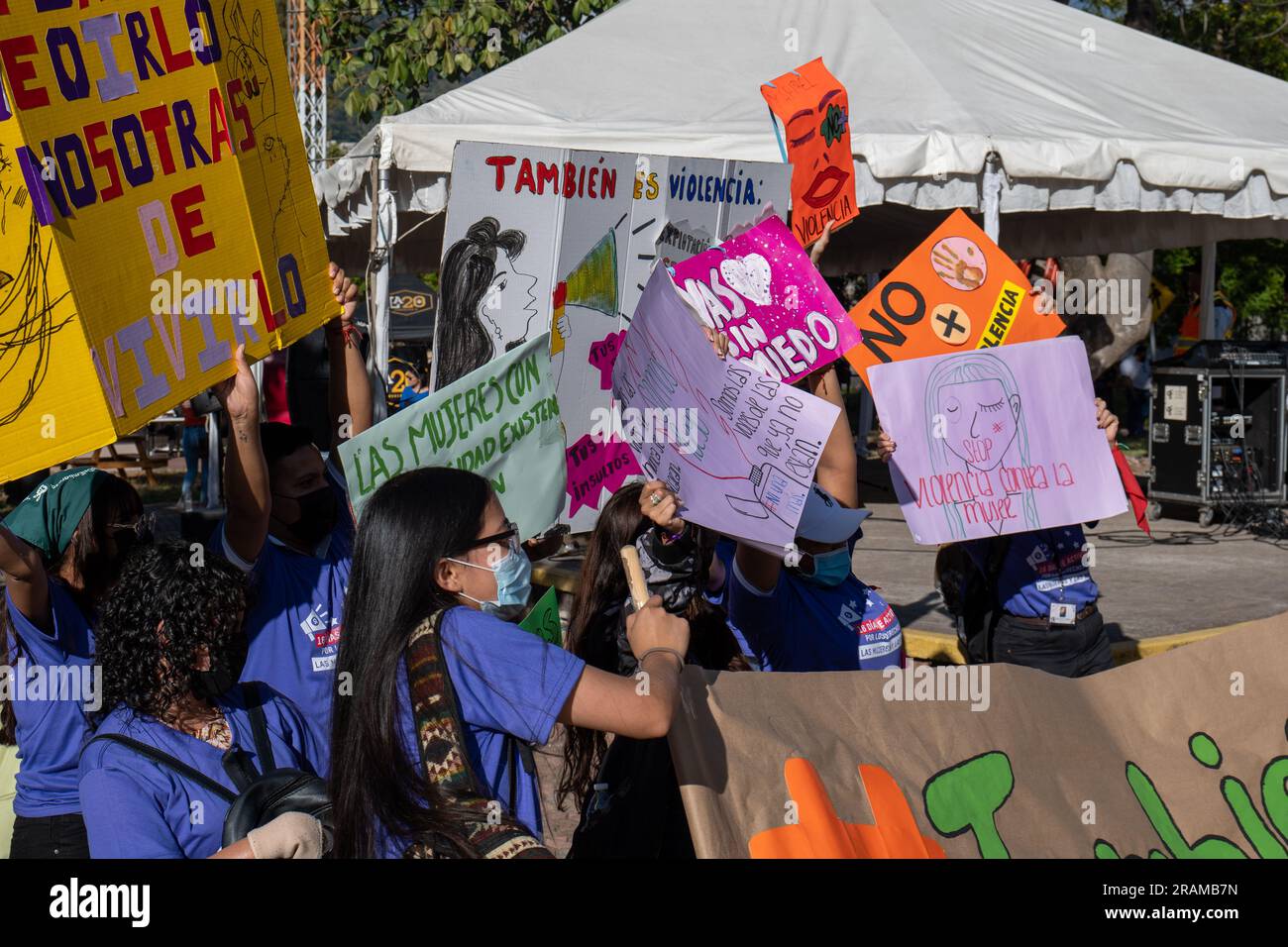Tegucigalpa, Francisco Morazan, Honduras - November 25, 2022: Young Brown Adults Hold Cardboard Signs at Protest for the International Day for the Eli Stock Photo