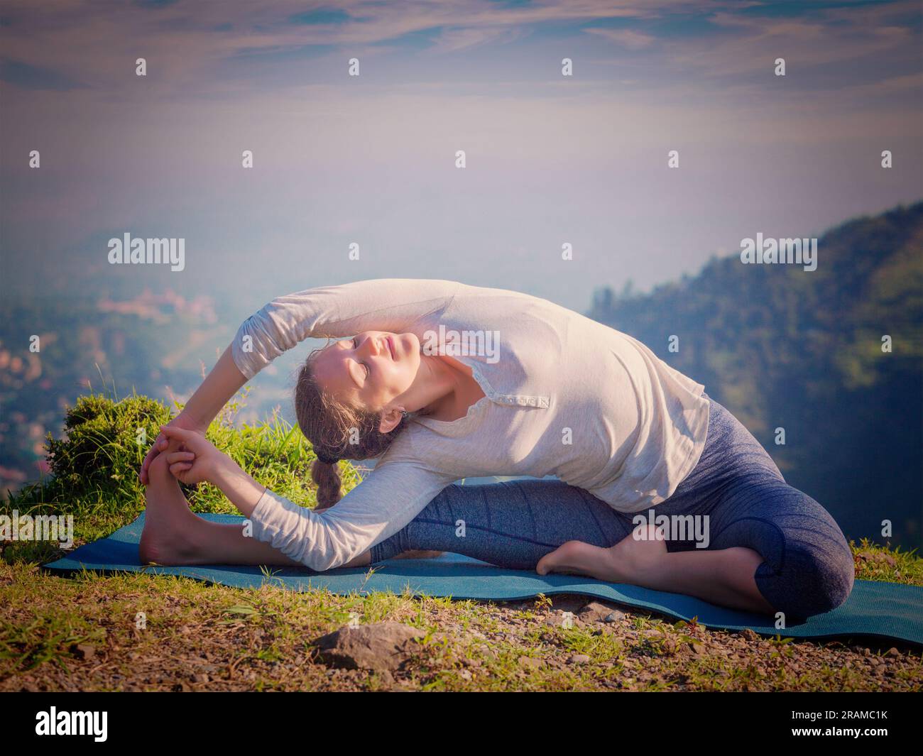 Young sporty fit woman doing Hatha Yoga asana Stock Photo