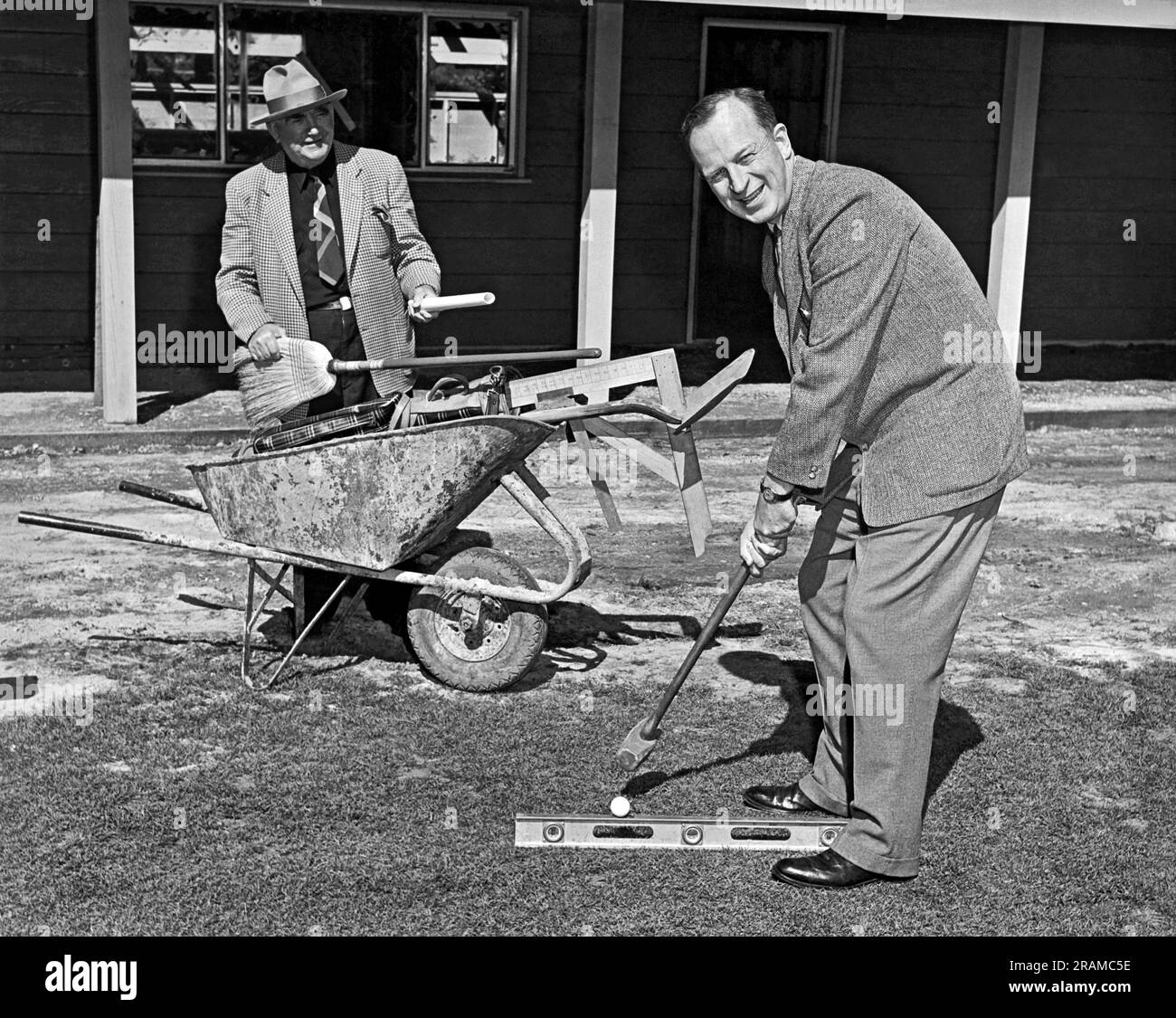 California: c. 1947. A man gets ready to tee off with a sledge hammer