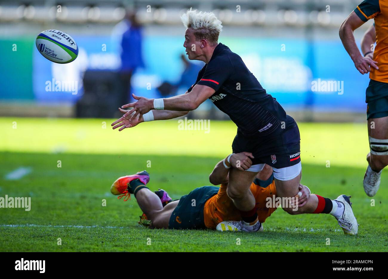 Cape Town, SOUTH AFRICA - Tuesday 04 July 2023, Sam Harris of England is tackled by Ronan Leahy of Australia during the World Rugby U20 Championship match between Australia and England at Athlone Stadium in Cape Town, South Africa. Stock Photo