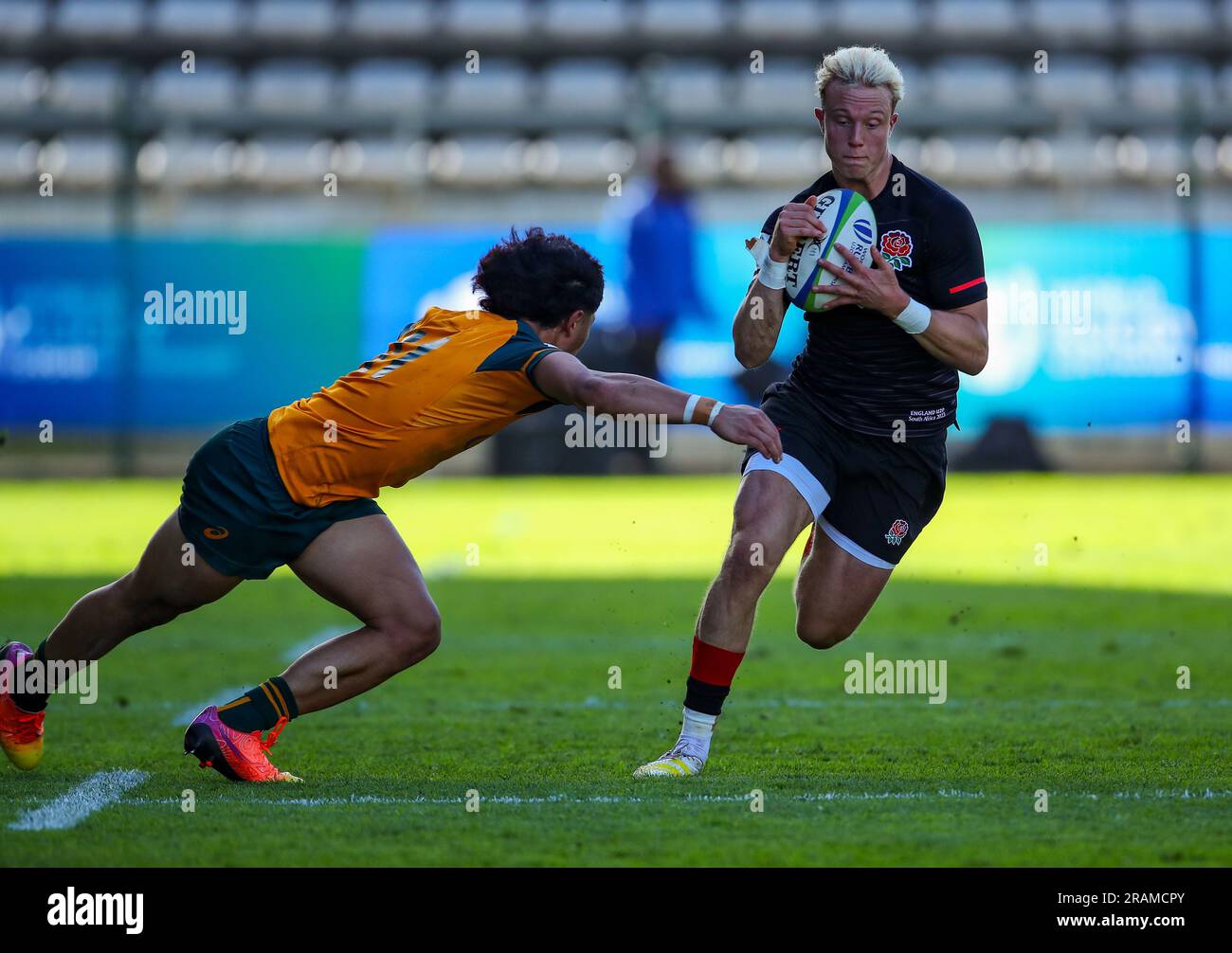 Cape Town, SOUTH AFRICA - Tuesday 04 July 2023, Sam Harris of England tries to evade Ronan Leahy of Australia during the World Rugby U20 Championship match between Australia and England at Athlone Stadium in Cape Town, South Africa. Stock Photo