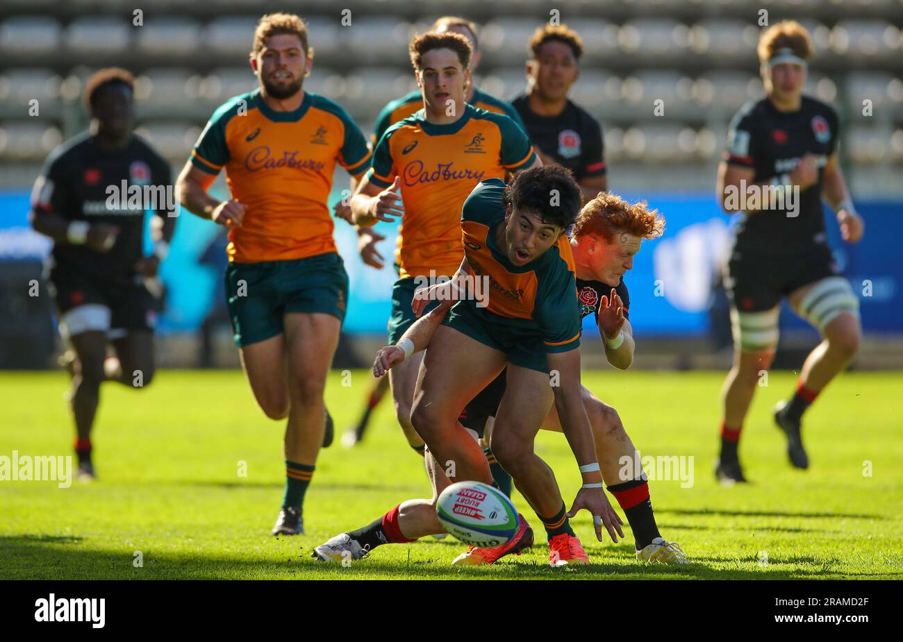Cape Town, SOUTH AFRICA - Tuesday 04 July 2023, Ronan Leahy of Australia is tackled by Lewis Chessum of England during the World Rugby U20 Championship match between Australia and England at Athlone Stadium in Cape Town, South Africa. Stock Photo