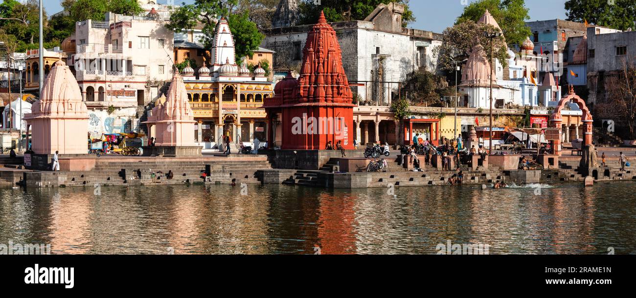 People bathing in sacred Rhipra River on ghats of the holy city of Ujjain Stock Photo
