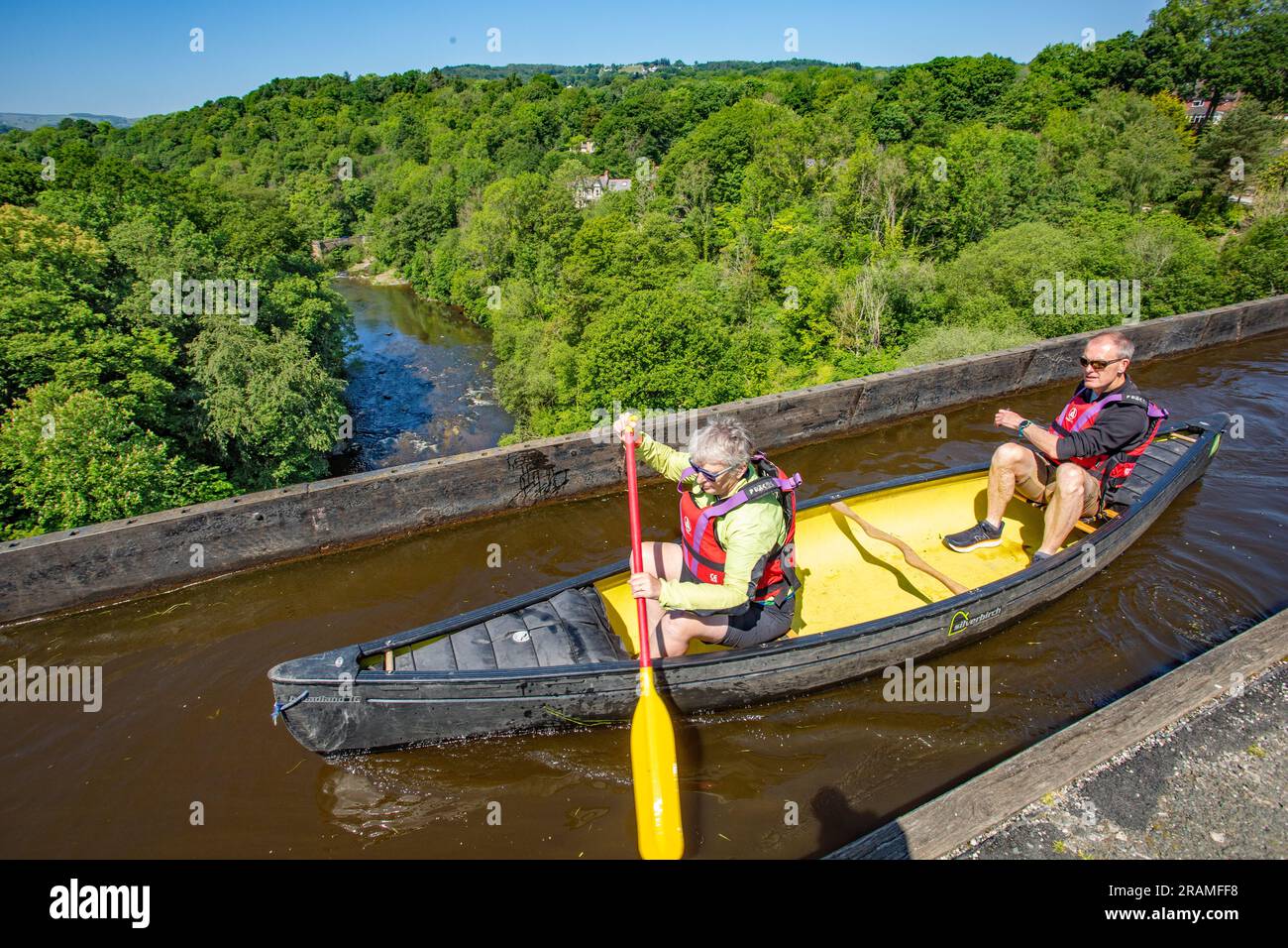Kayak Canoe crossing 38 meters above the river Dee valley on the  Pontcysyllte Aqueduct near Llangollen North Wales, a UNESCO world heritage site Stock Photo