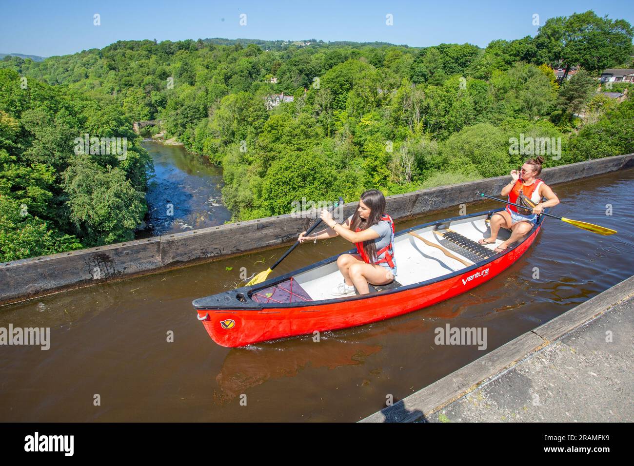 Kayak Canoe crossing 38 meters above the river Dee valley on the  Pontcysyllte Aqueduct near Llangollen North Wales, a UNESCO world heritage site Stock Photo