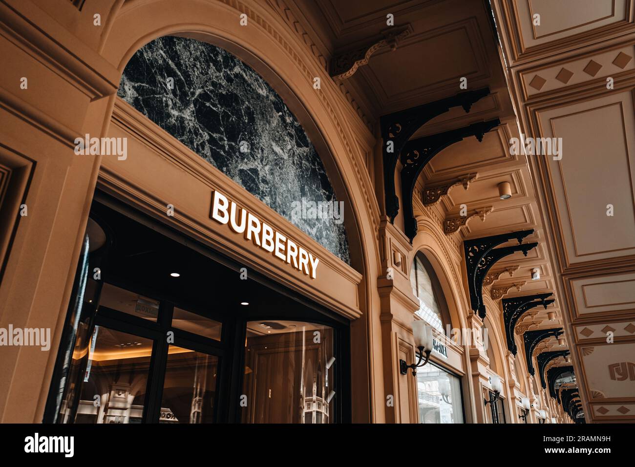 Brown classic historical facade of Burberry boutique. Burberry is a British luxurious clothing brand Stock Photo