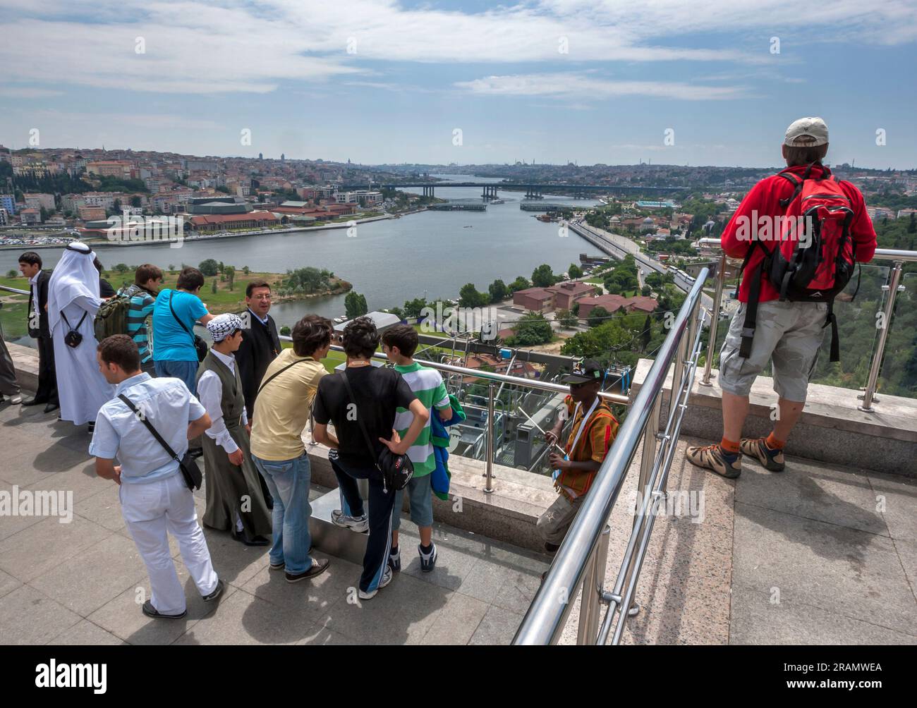 ISTANBUL, TURKIYE - JUNE 30, 2011 - Tourists stand on the viewing platform at Pierre Loti (Piyerloti) Hill which overlooks Golden Horn at Istanbul in Stock Photo