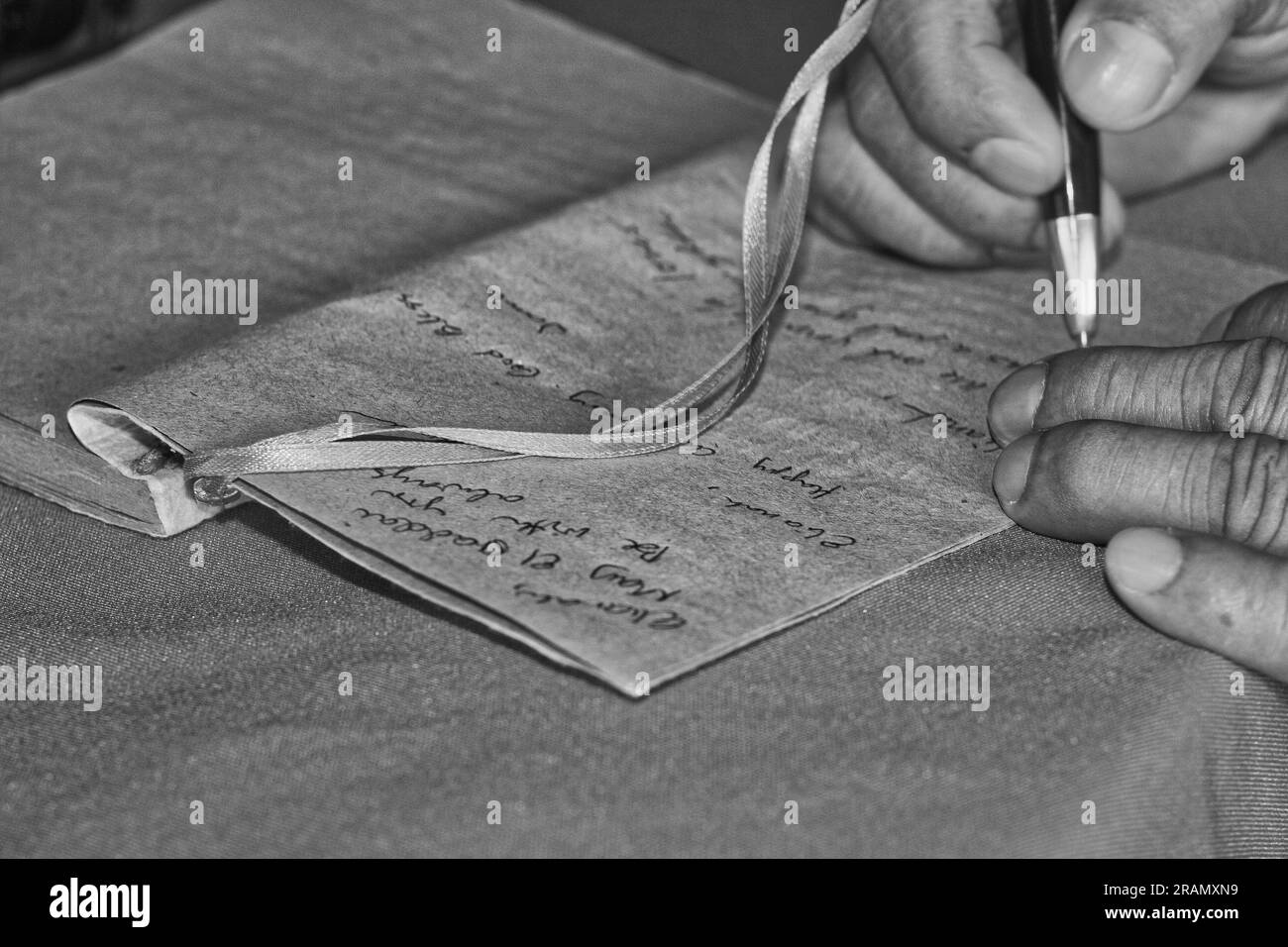 writing a note for someone Stock Photo - Alamy