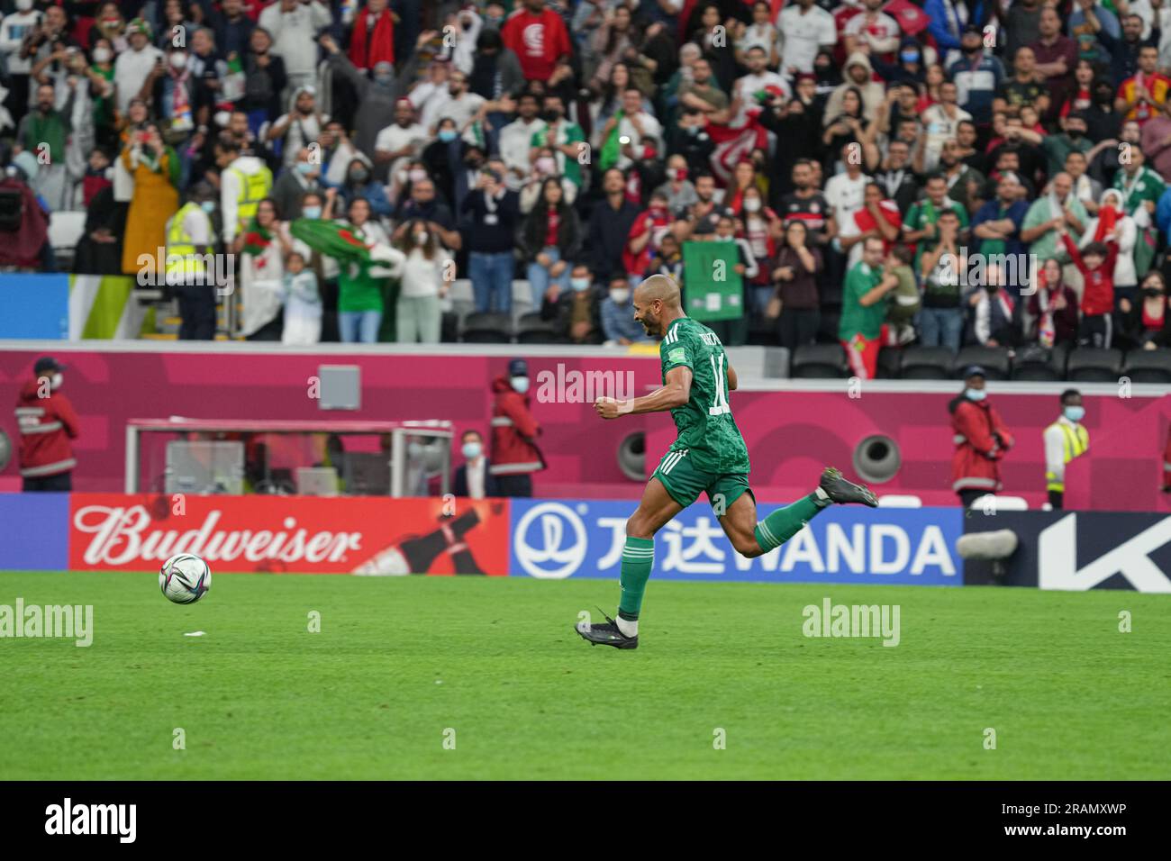 Yacine Brahimi started celebrating before scoring the goal that sealed Algeria's win during the FIFA Arab Cup final match. Stock Photo