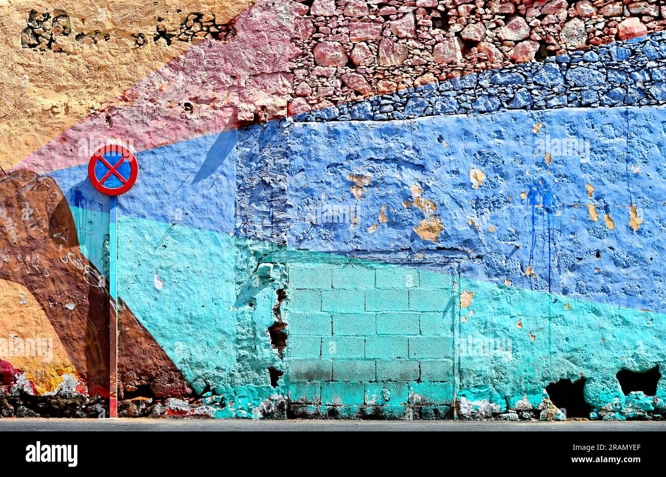 Lanzarote Canary Islands Arrecife town artistically painted and  colourful town wall in blue with rough stone wall in the city centre Stock Photo