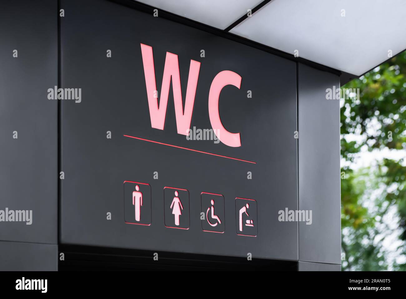 Sign of public toilet with different symbols Stock Photo Alamy
