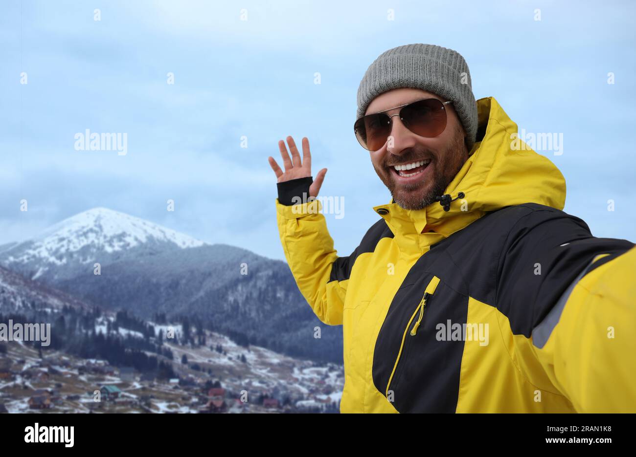 Man taking picture with mobile phone in mountains hi-res stock ...