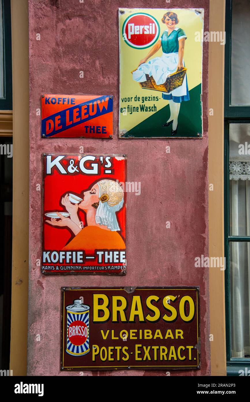 old tin product signs for sale at the sweetshop or general store at the Zuiderzee Museum Stock Photo