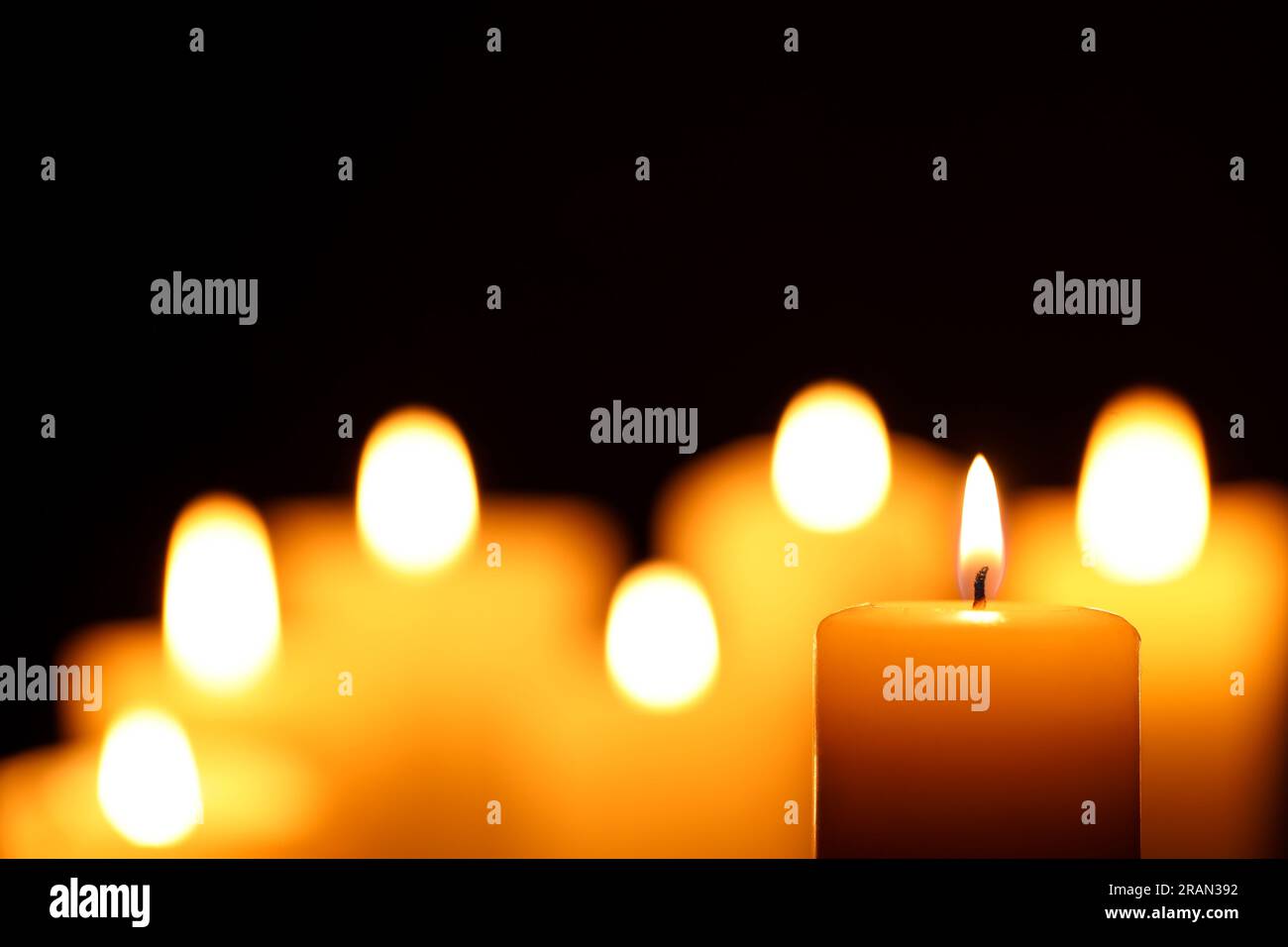 Burning candle on black background, closeup. Space for text Stock Photo ...