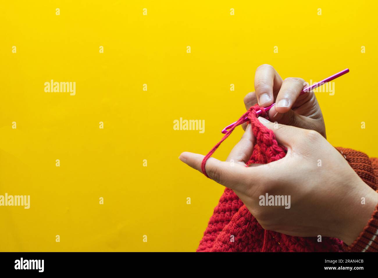 Detail of hands knitting with a crochet needle Stock Photo Alamy