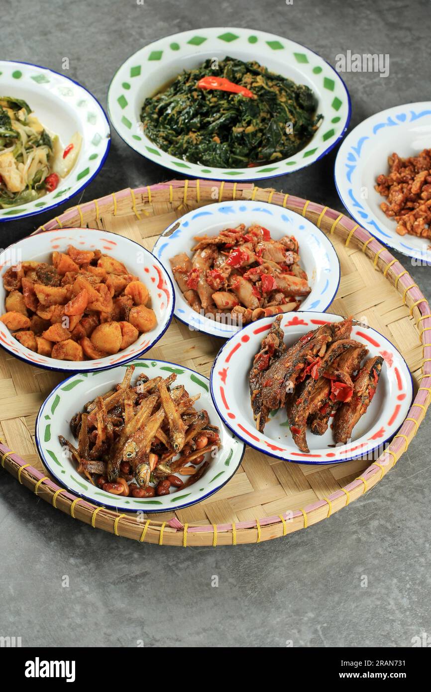 Various Indonesian Side Dish on Warung Tegal, Warteg Menu Nasi Campur Stock Photo