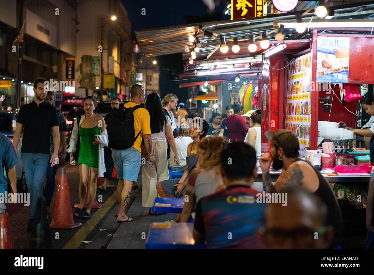 Kuala Lumpur, Malaysia - July 1, 2023: Street scene of KL Chinatown during evening, dusk hour. Chinatown is very popular for eatery and shopping among Stock Photo