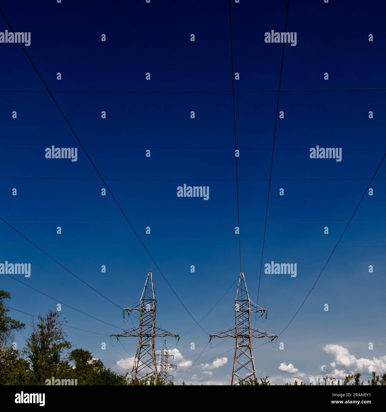High voltage electrical lines and equipment against the blue sky Stock ...