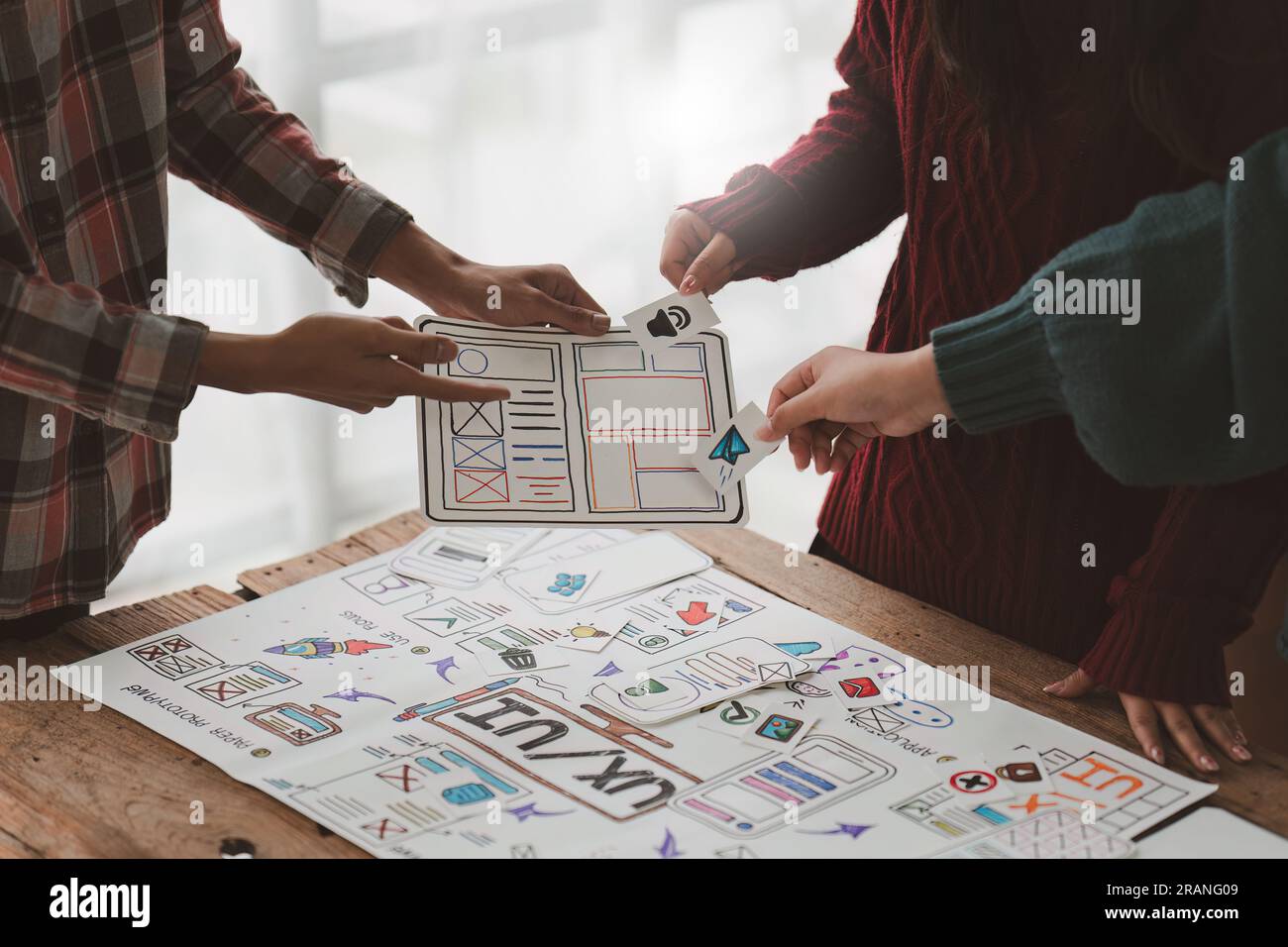 Close up ux developer and ui designer brainstorming interface wireframe ...