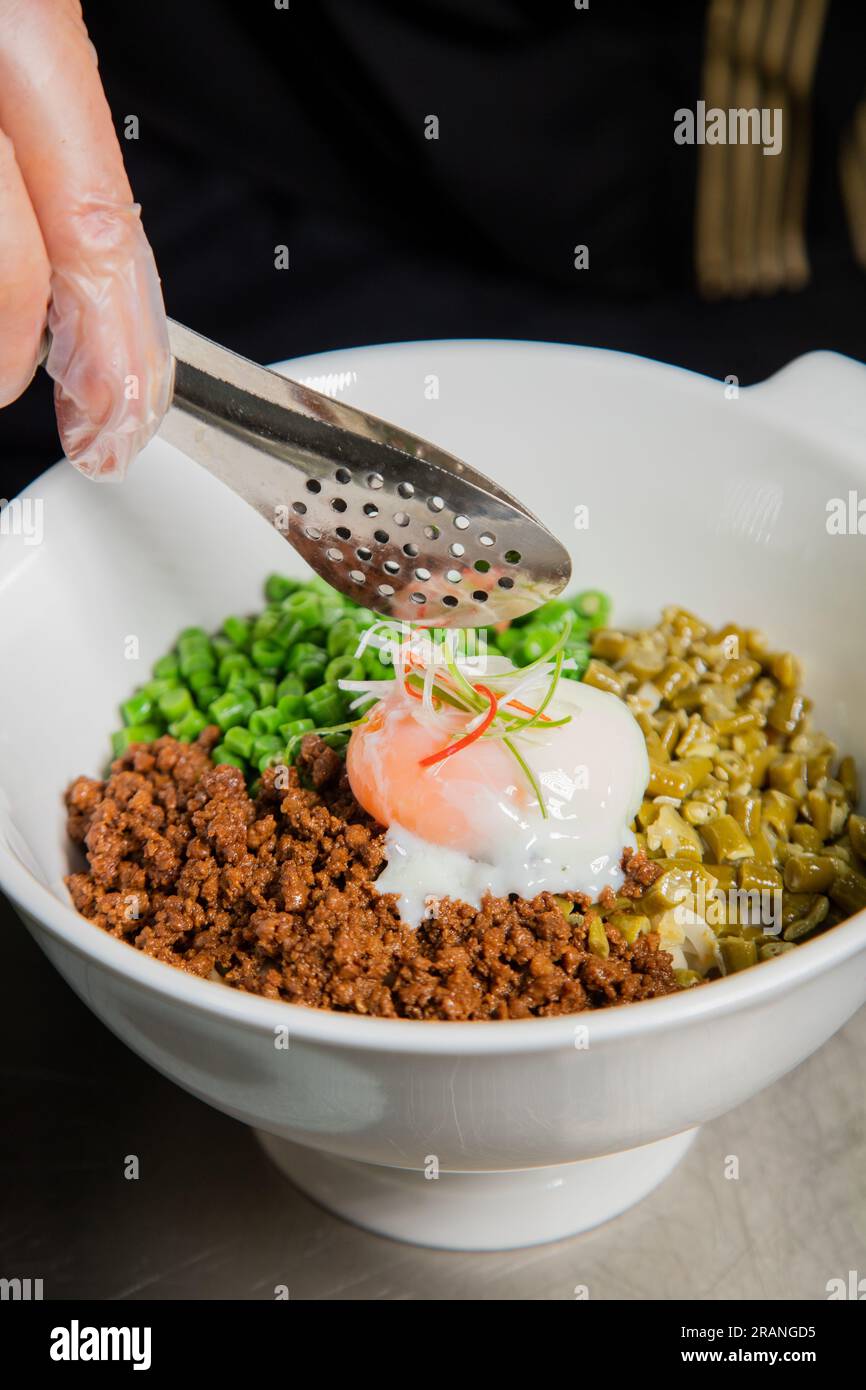 Zhajiangmian, (Chinese dish of ground pork over wheat noodles) Isolated